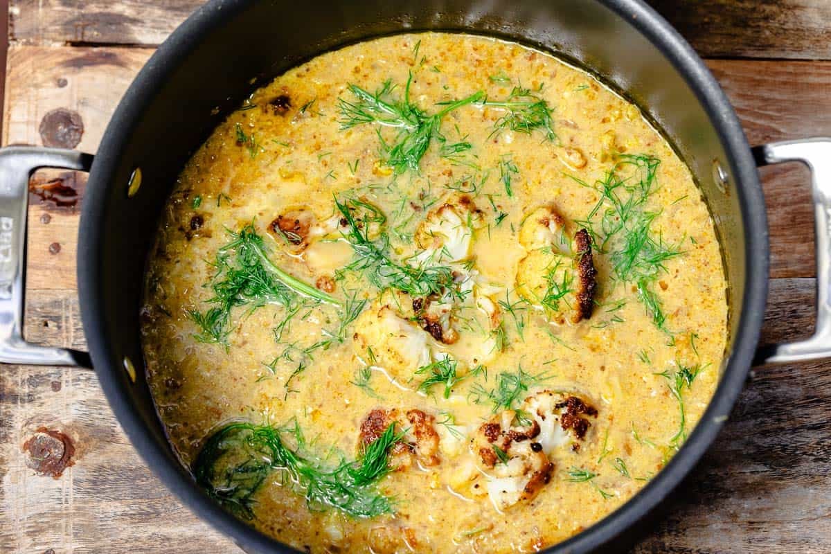 close up of a pot of roasted cauliflower soup.