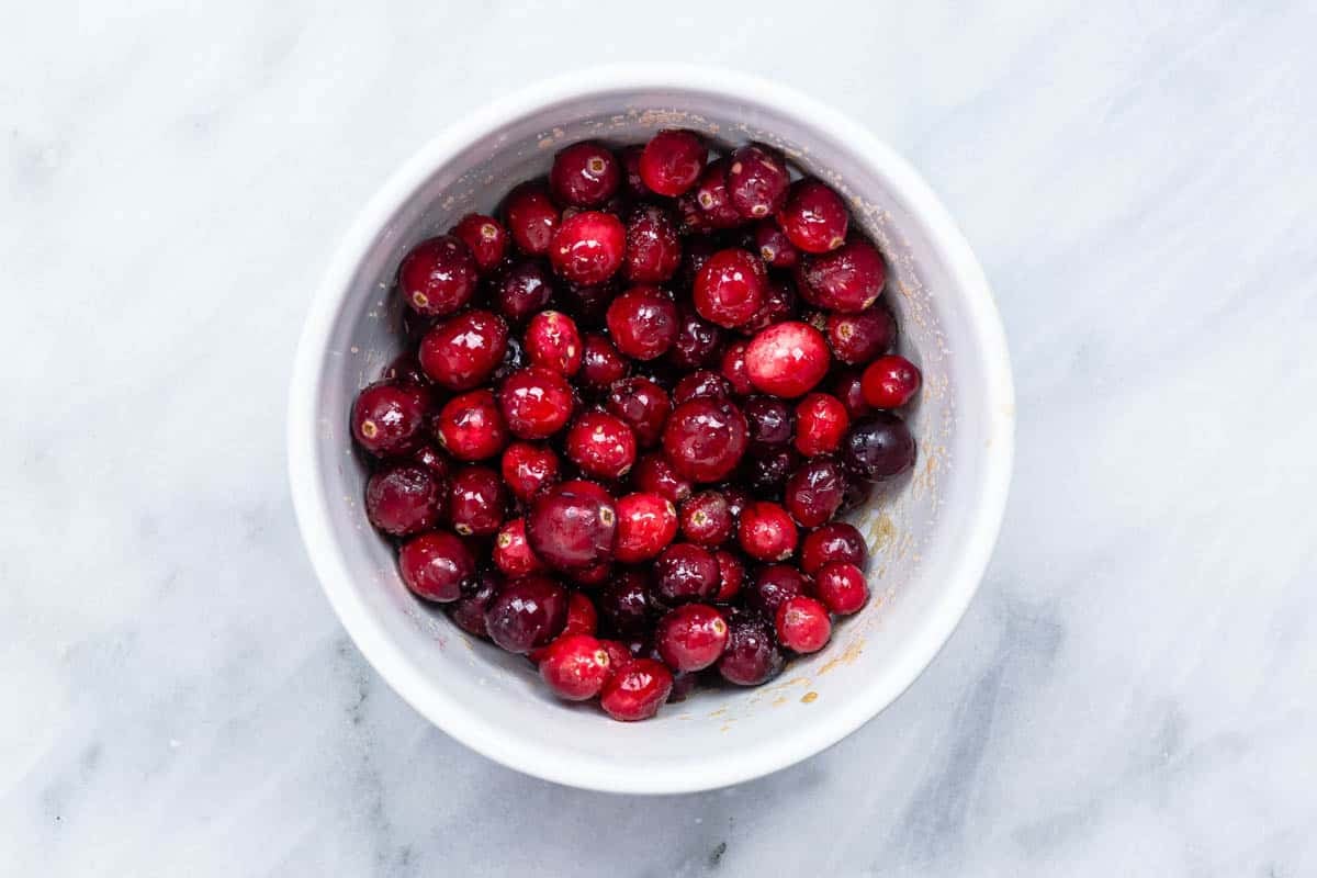 fresh cranberries in a white bowl.