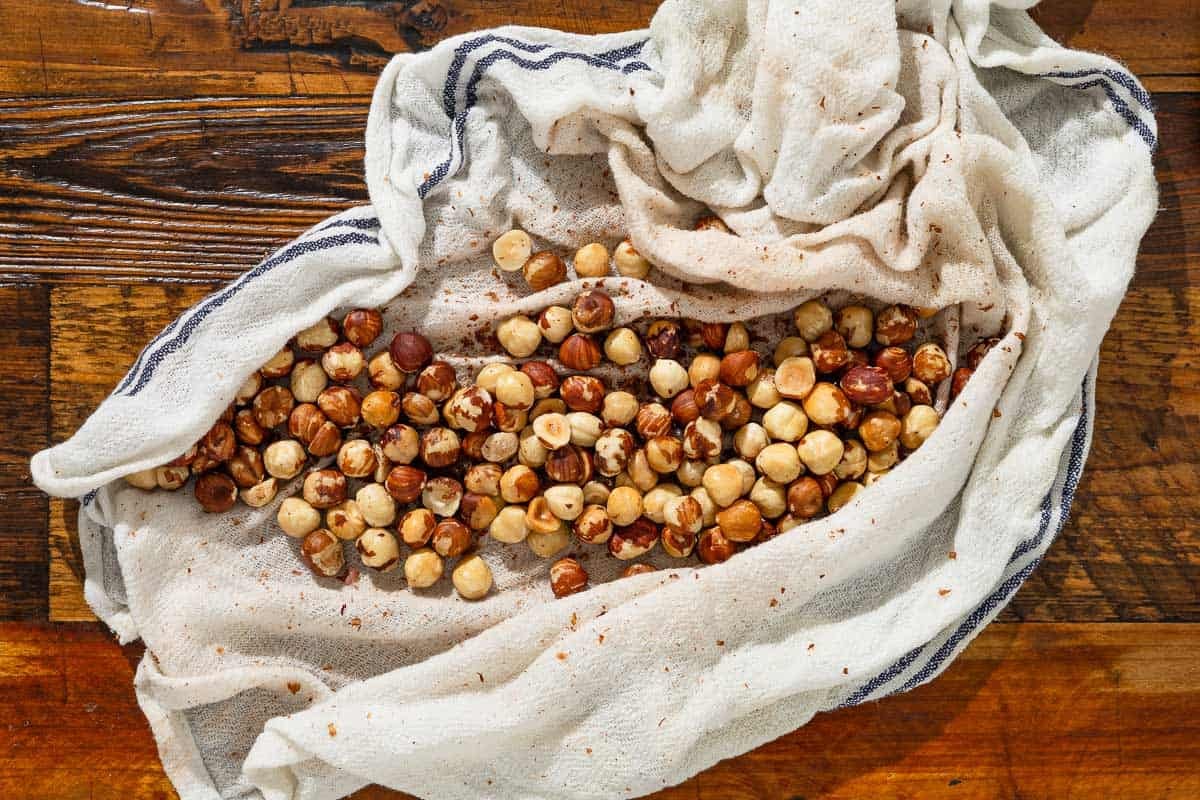 roasted hazelnuts on a damp tea towel.