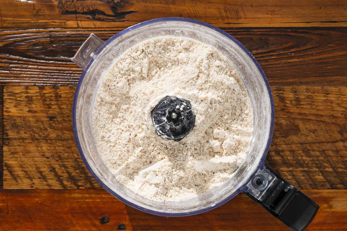 all dry ingredients in the bowl of a food processor after grinding.