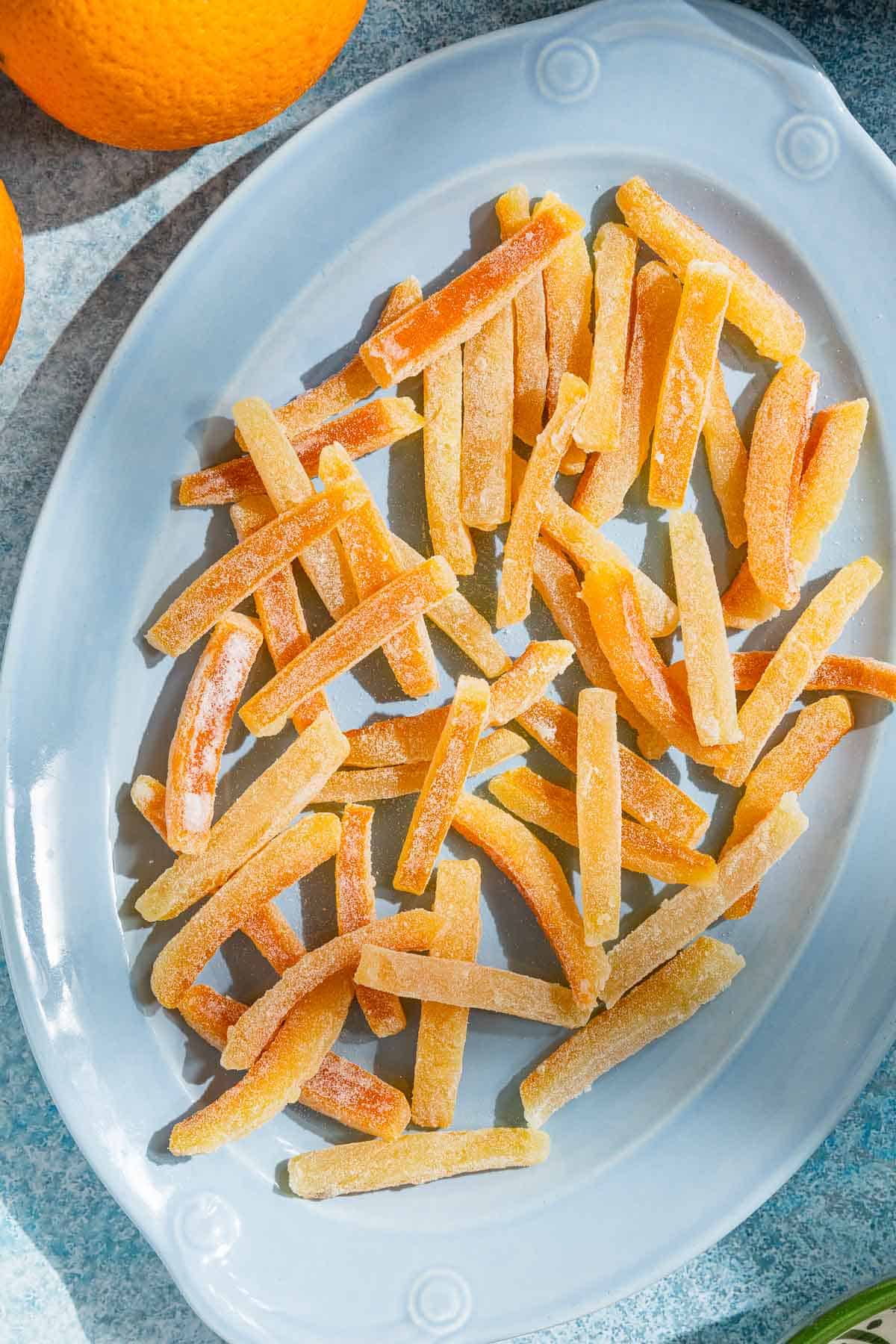 an overhead photo of candied orange peels on a serving platter.