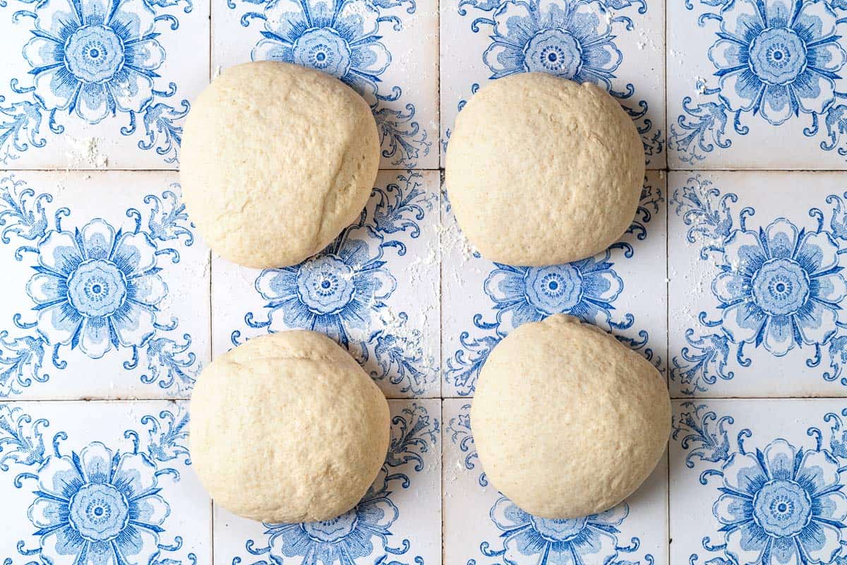 taboon flatbread dough divided into 4 equal portions.