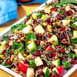 side shot of wild rice salad on a rectangular serving platter.