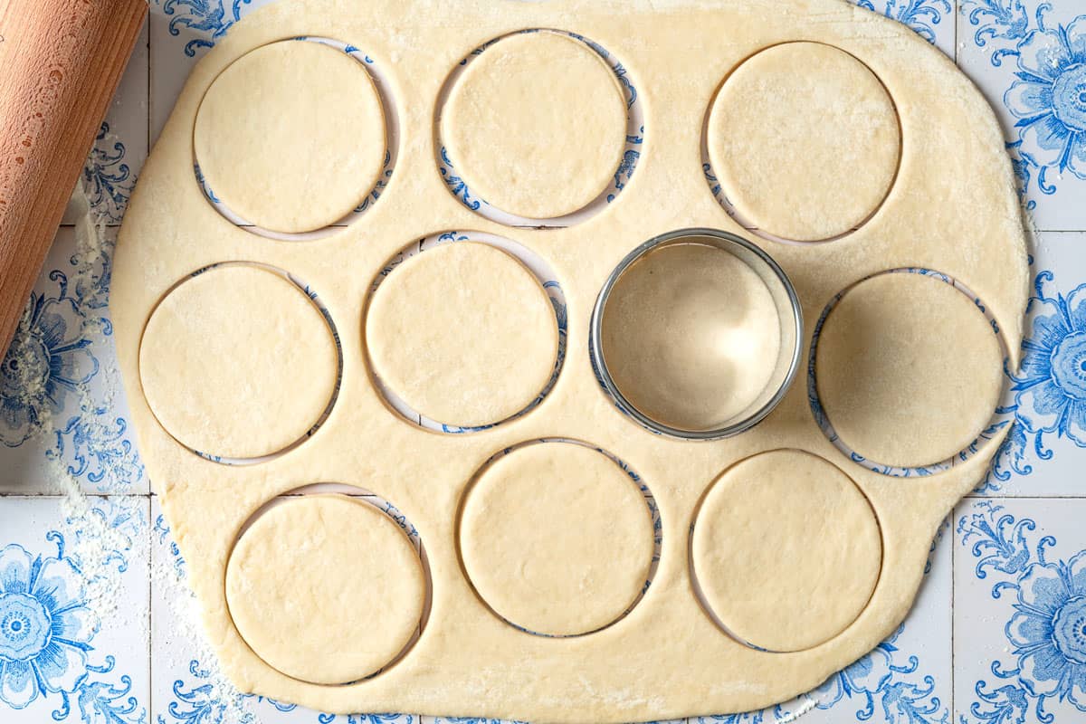 The rolled dough for the fatayer being cut into individual circles.