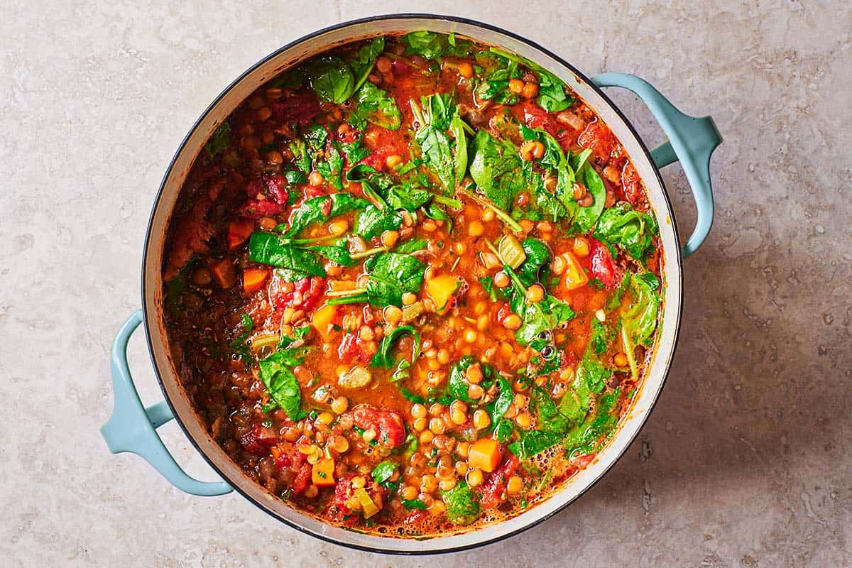 an overhead photo of a pot of Italian lentil soup.