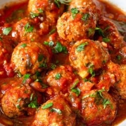 a close up of a serving of moroccan fish kofta in a bowl.