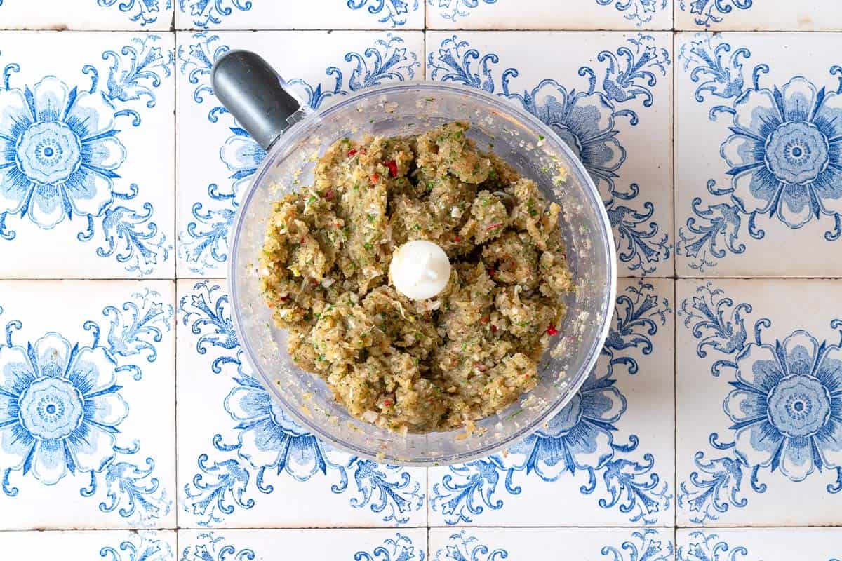 the mixture for moroccan fish kofta in the bowl of a food processor.