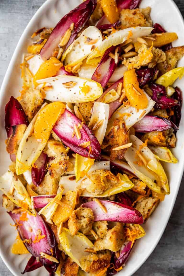 an overhead photo of endive salad in a serving bowl.