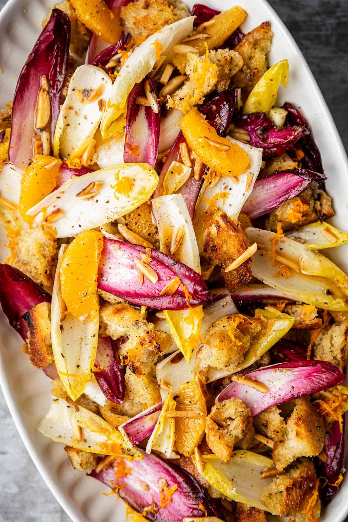 an overhead photo of endive salad in a serving bowl.