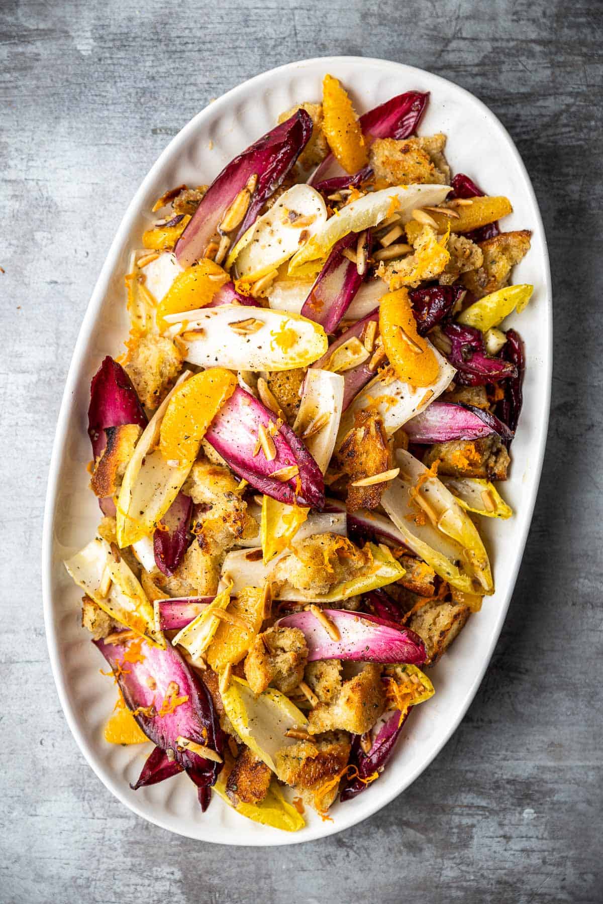 an overhead photo of endive salad in a serving bowl.