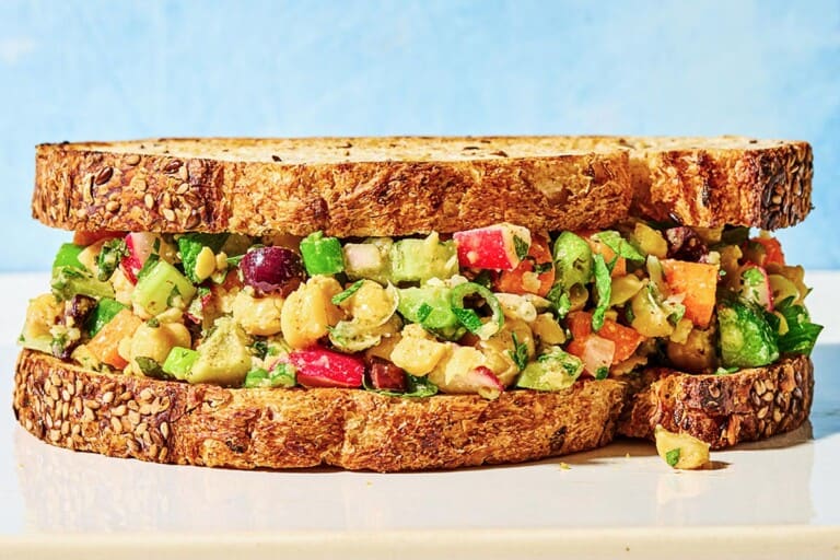 A close up of a vegan chickpea salad sandwich.