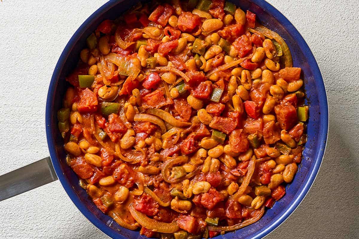 An overhead photo of the white bean shakshuka sauce in a skillet.