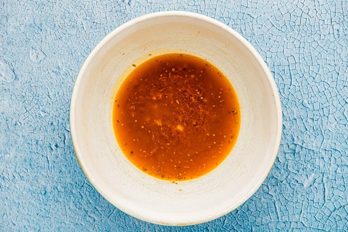 the sauce for the sheet pan shrimp mixed together in a bowl.