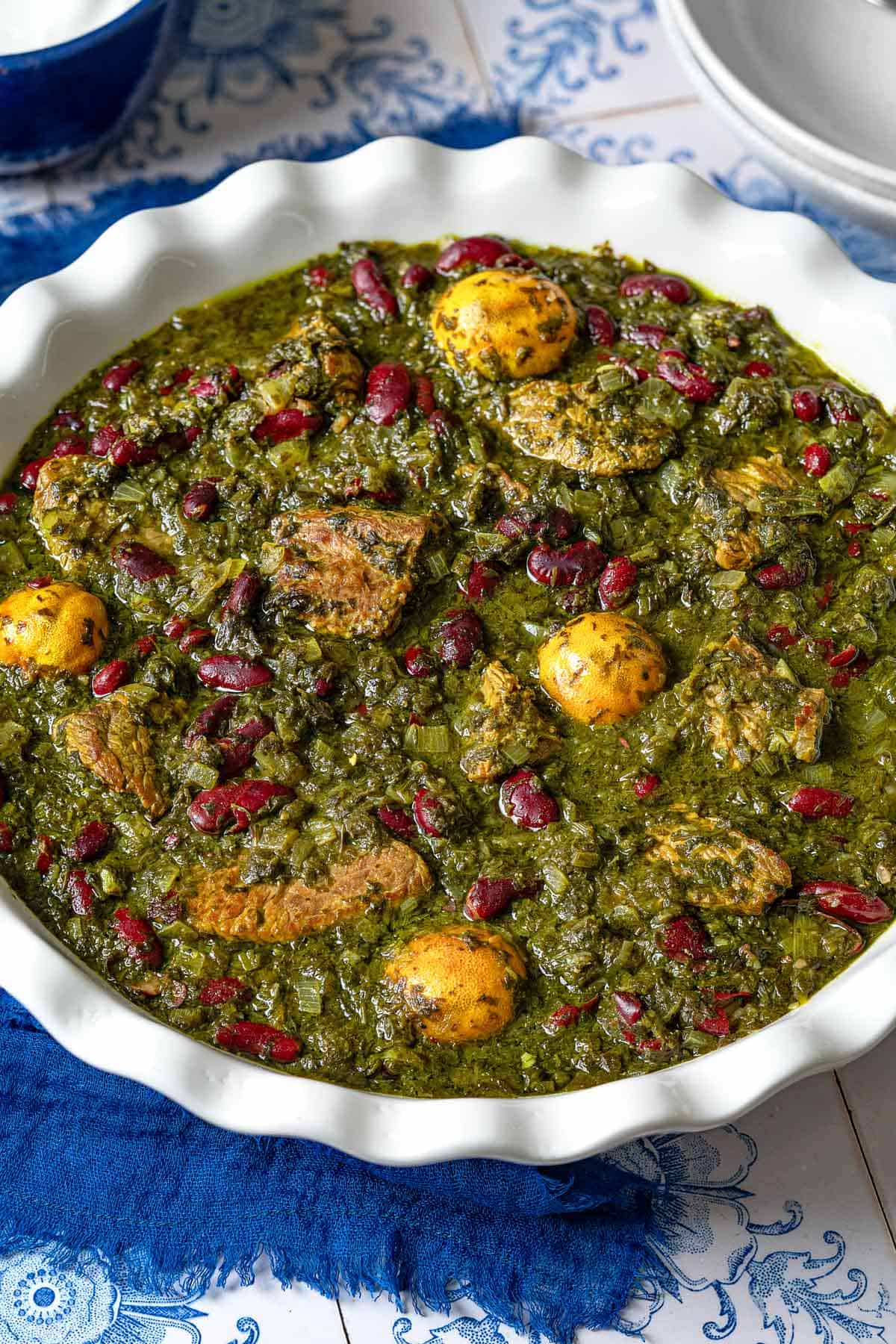 A close up of ghormeh sabzi in a serving bowl.