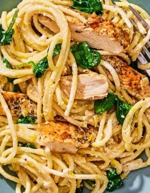 Lemon chicken pasta on a plate with a fork.