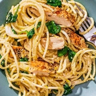 Lemon chicken pasta on a plate with a fork.