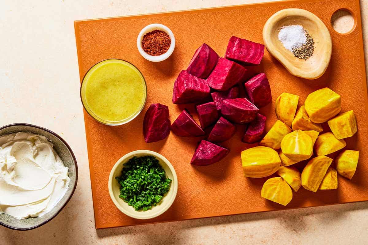 Ingredients for beets including golden beets, red beets, salt, pepper, aleppo pepper, chives, apple cider vinaigrette, and labneh.