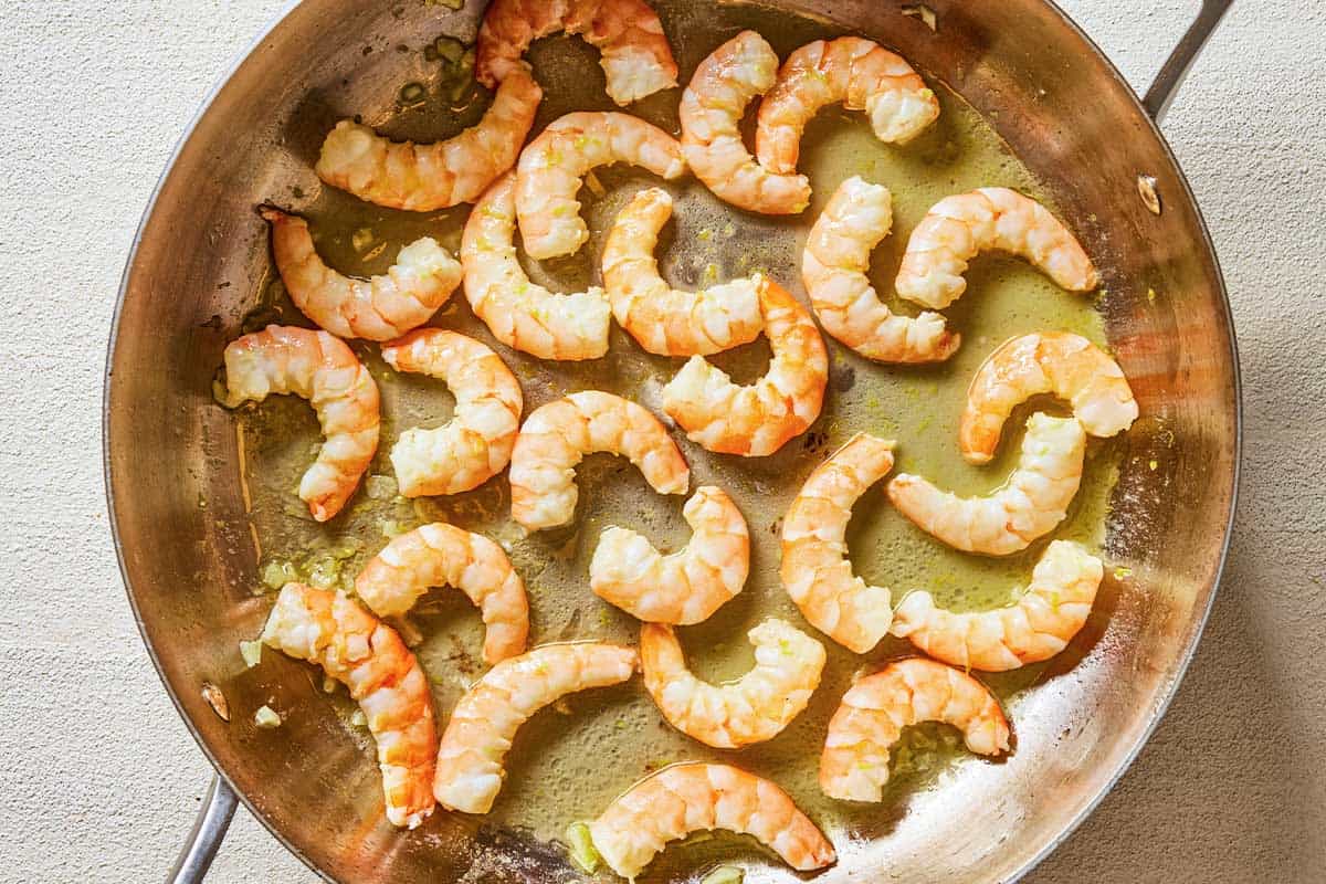 shrimp cooking in a skillet.