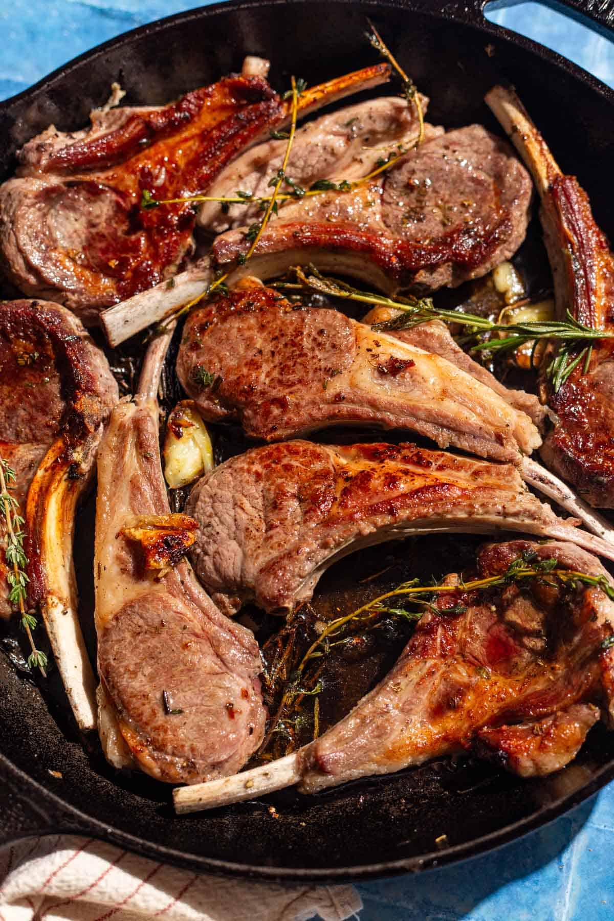 Pan seared lamb chops in a cast iron skillet.