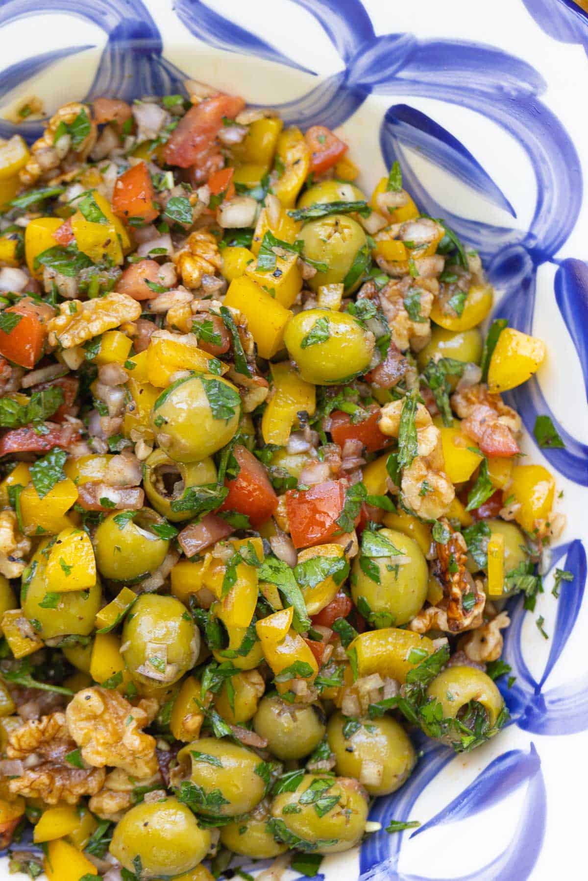 A close up of olive salad in a serving bowl.