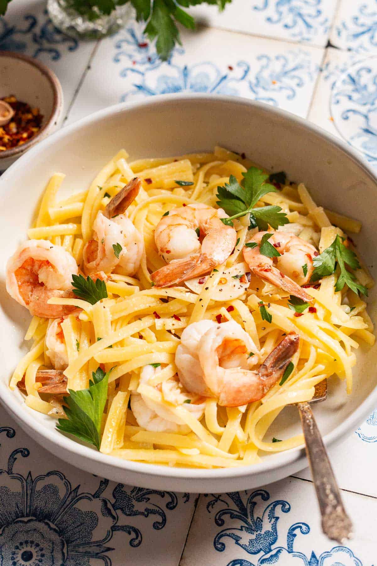 Shrimp linguine in a bowl with a fork.