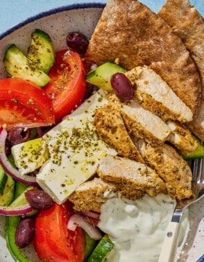 An overhead photo of a gyro bowl with a fork.