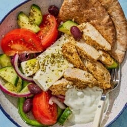 An overhead photo of a gyro bowl with a fork.