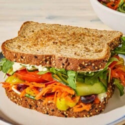 A veggie sandwich on a plate.
