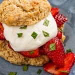 A close up of a strawberry shortcake on a plate. - 18