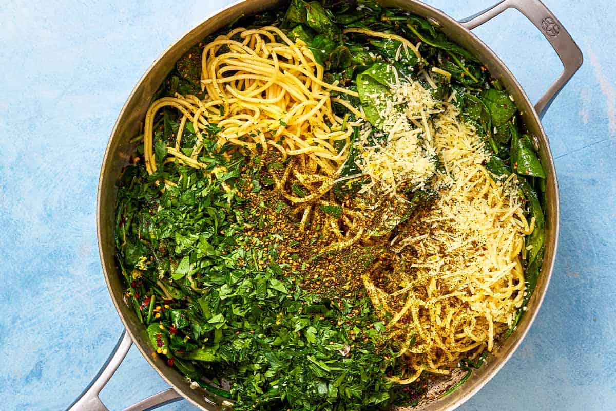 The ingredients for the za'atar garlic spinach pasta in a sautee pan, just before being mixed together.