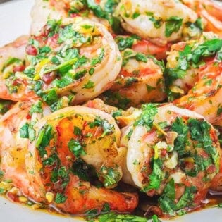 A close up of cilantro lime shrimp on a plate.