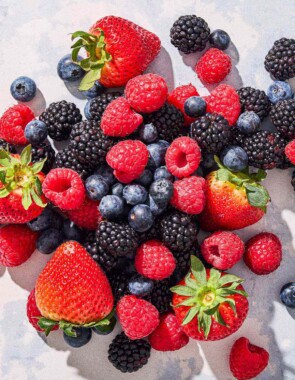 A close up of a blueberries, blackberries and strawberries.