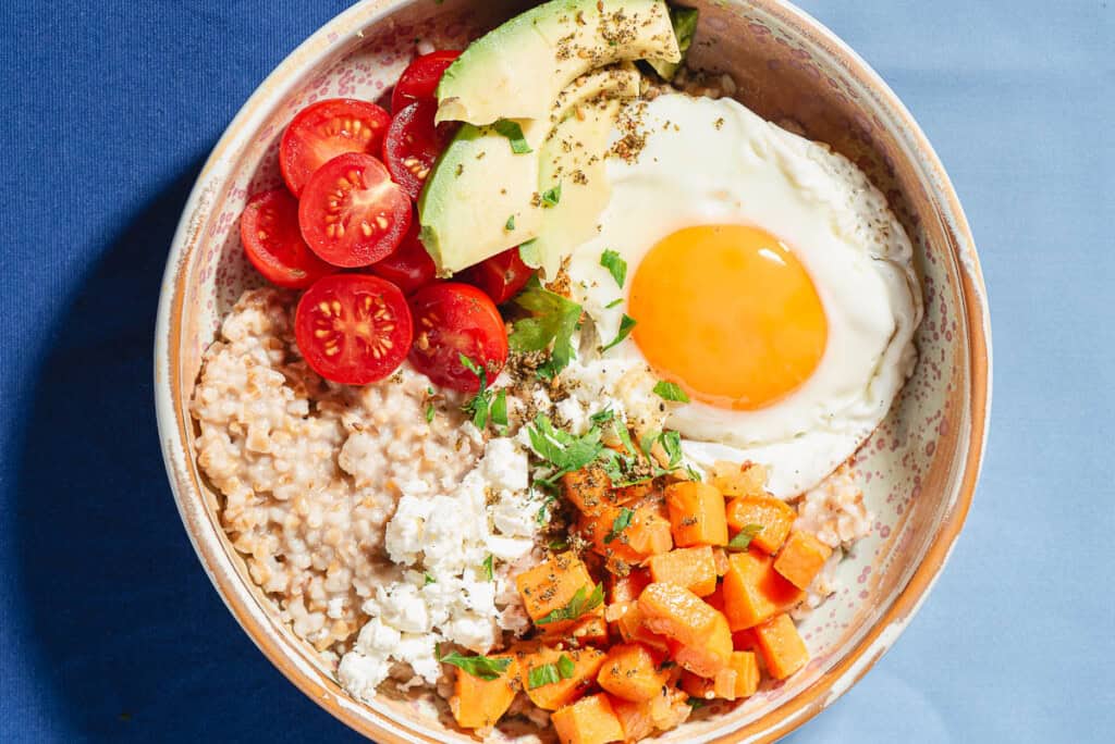 An overhead photo of a savory oatmeal bowl.