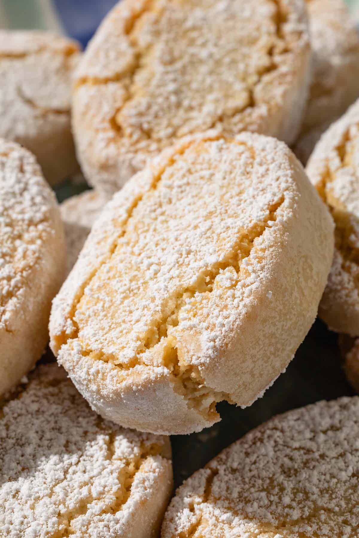 A close up of baked ricciarelli cookies.