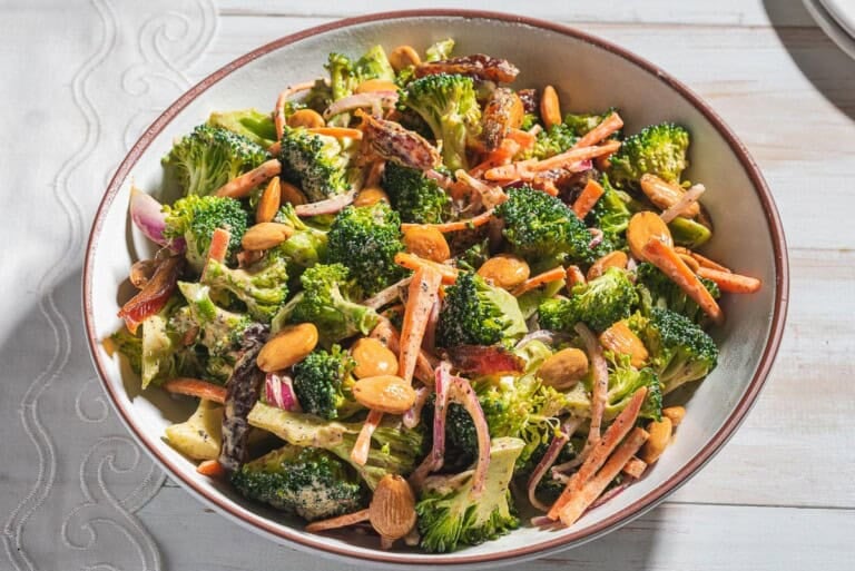 A close up of broccoli salad in a serving bowl.