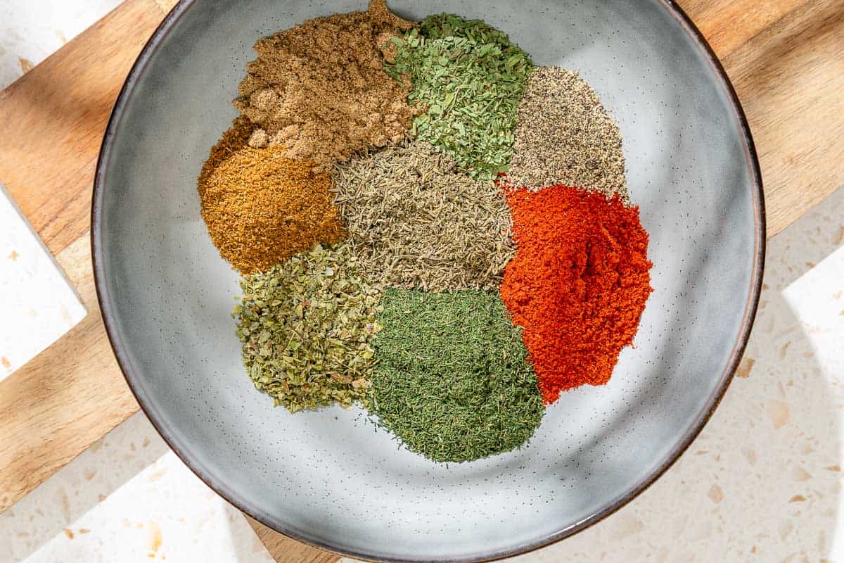 The ingredients for the fish seasoning in a bowl just before being mixed together.