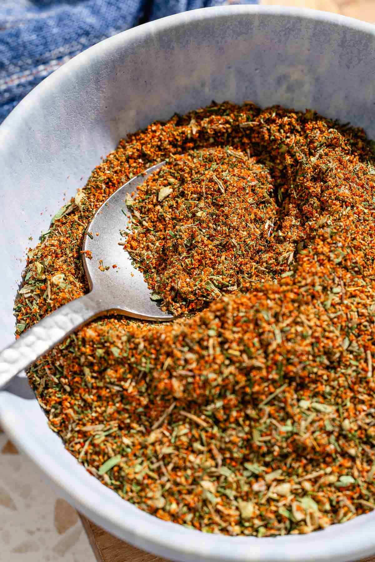 Fish seasoning in a bowl with a spoon.