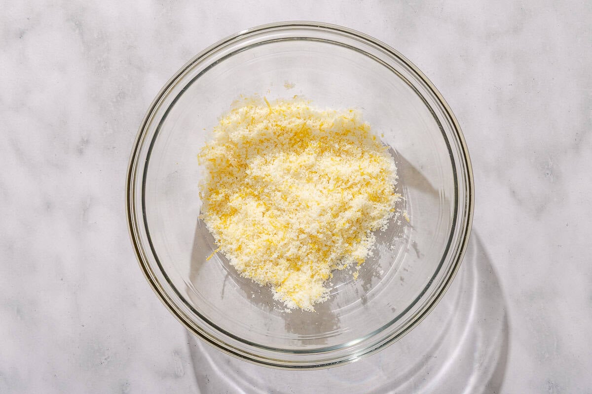 Sugar, lemon zest and corn starch mixed together in a bowl.