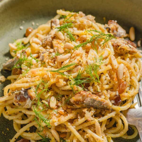 Sardine pasta in a bowl with a fork.