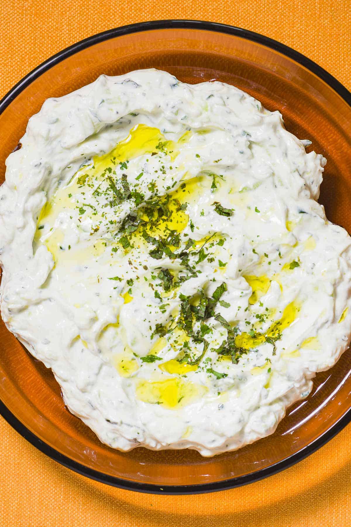 Maast O'Khiar garnished with dried mint and a drizzle of olive oil in a bowl.