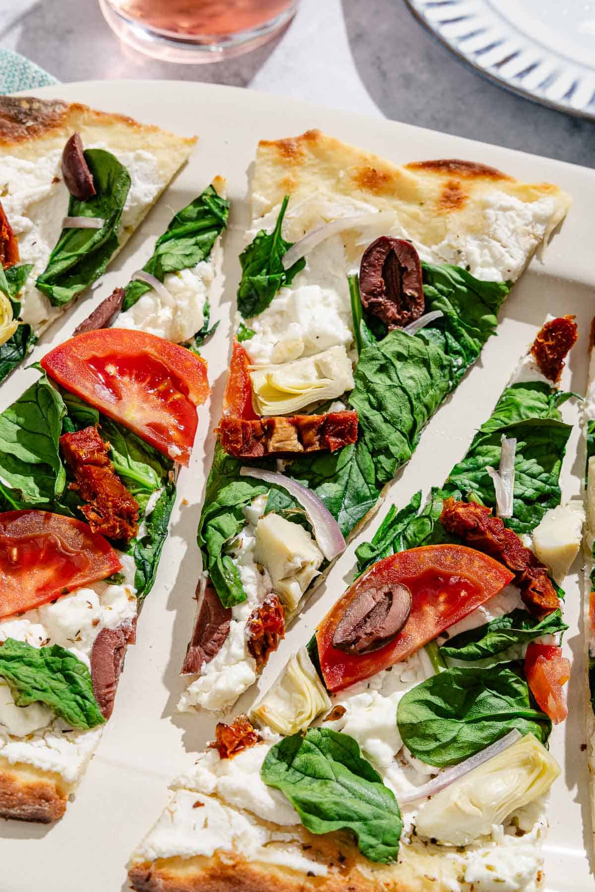 Slices of the flatbread pizza on a platter.