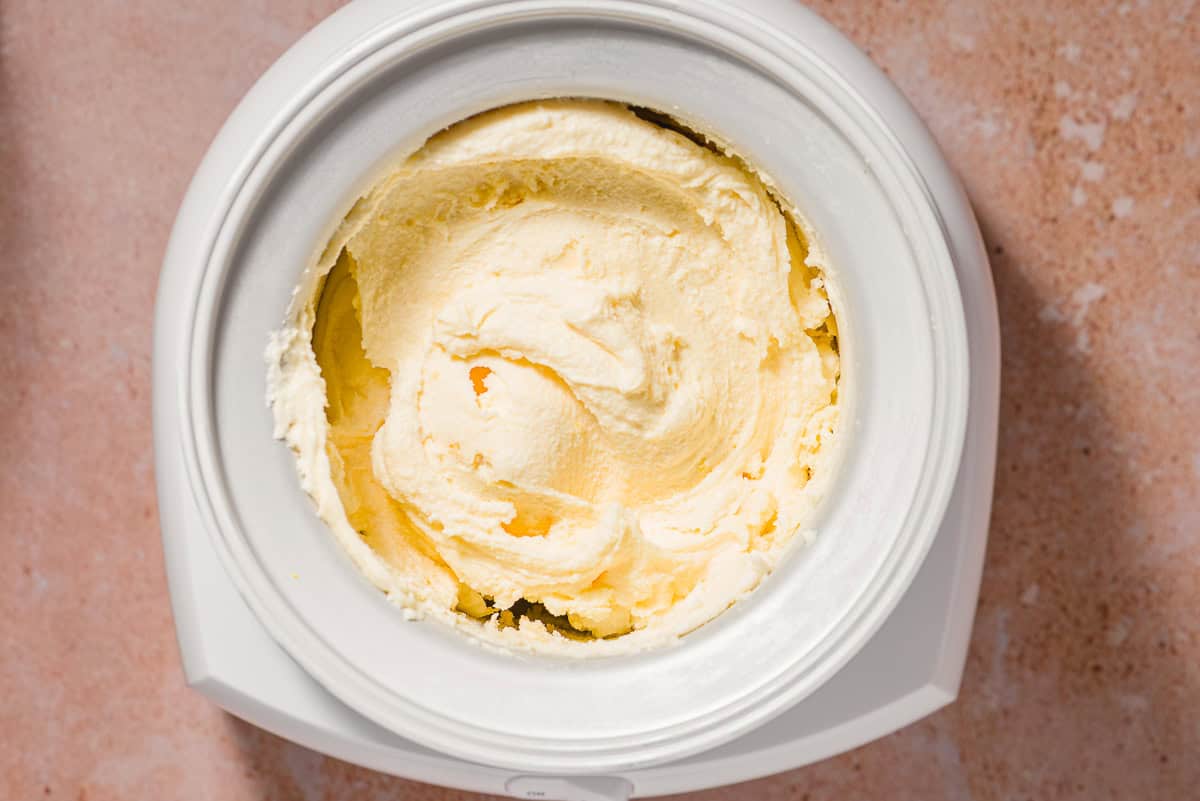 Olive oil ice cream churning in an ice cream maker.