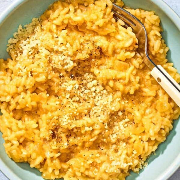 Risotto in a bowl with a fork.