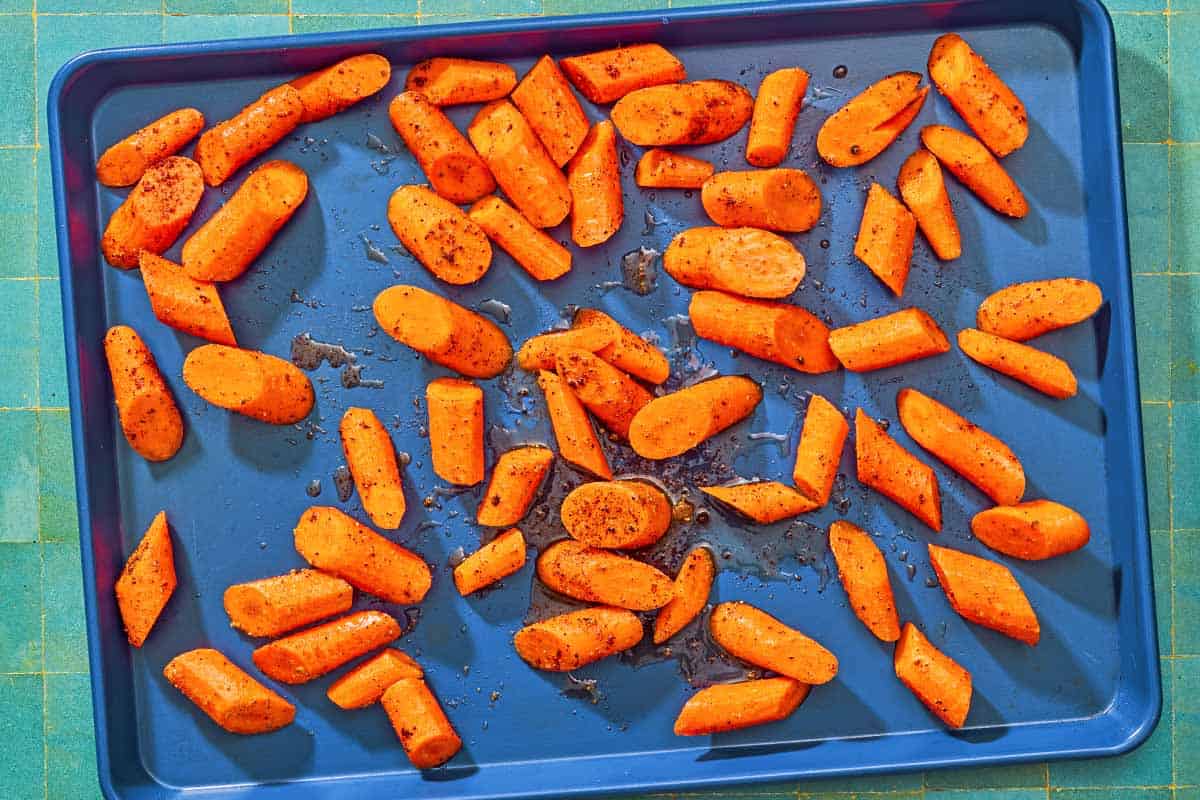 The roasted carrots for the roasted carrot recipe on a sheet pan.