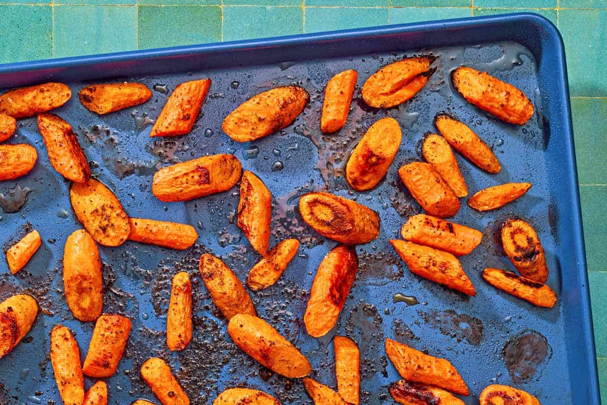 The roasted carrots for the roasted carrot recipe on a sheet pan.