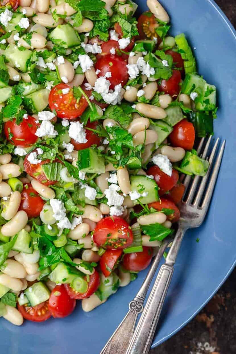 White bean salad topped with feta cheese. Ready to serve