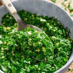 Gremolata in a bowl with a spoon.