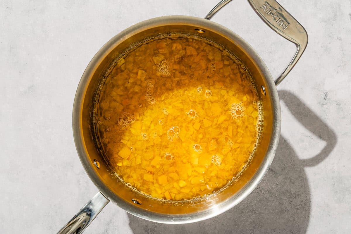 The syrup for the peach tea in a saucepan.