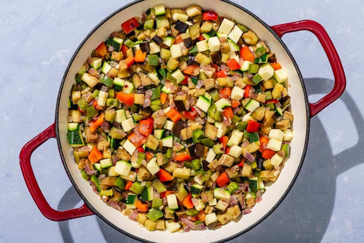 The chopped vegetables for the pisto in a skillet after being sautéed.