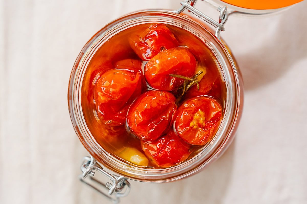An overhead photo of the open jar of tomato confit.